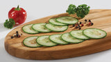 Photo of thinly sliced Cucumber on a wooden board